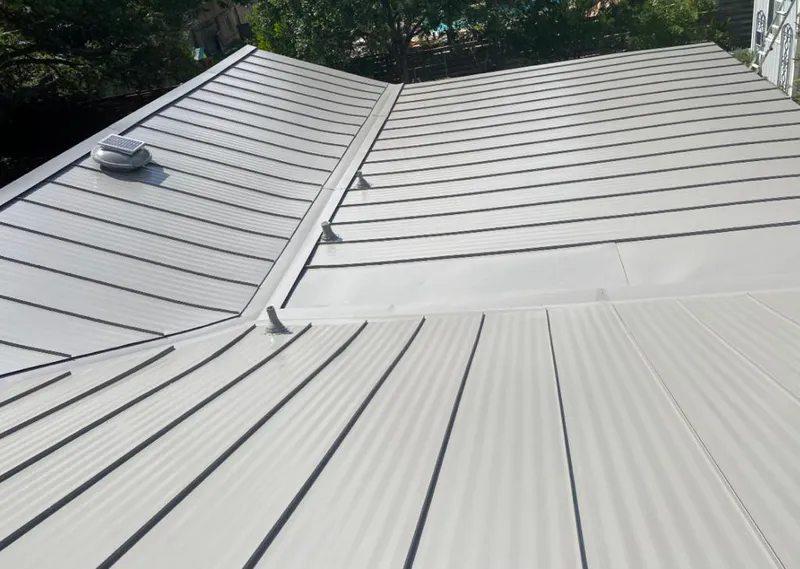Solar attic fan installed on a metal roof for Roof Ventilation in Schererville